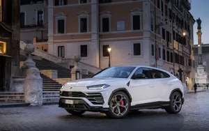 Sleek And Powerful Lamborghini Urus Suv In Action Wallpaper