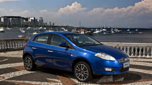 Sleek And Smooth Fiat Bravo All Poised On Roadway Wallpaper