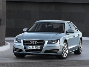 Sleek And Sophisicated Audi S8 Accelerating On An Open Road. Wallpaper