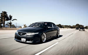 Sleek And Sophisticated Acura Tsx On The Road Wallpaper