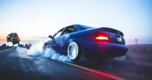 Sleek And Sophisticated Audi A4 In Action Wallpaper