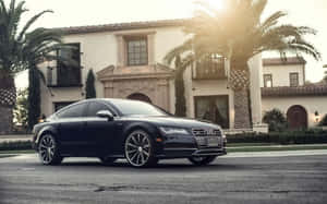 Sleek And Sophisticated Audi S7 In Motion Wallpaper