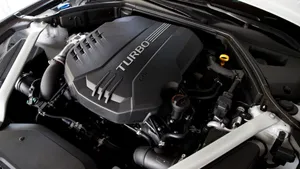 Sleek And Sophisticated Genesis G70 Luxury Sedan On The Road Wallpaper