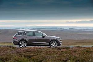 Sleek And Sophisticated Genesis Gv70 Suv Wallpaper