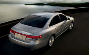 Sleek And Sophisticated Hyundai Azera On An Open Road Wallpaper