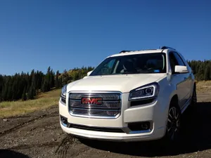 Sleek And Spacious Gmc Acadia Suv In A Natural Setting Wallpaper