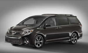 Sleek And Spacious Toyota Sienna In Urban Scenery Wallpaper