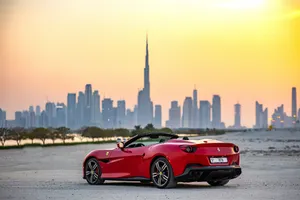Sleek And Speedy Ferrari Portofino Cruising On Open Road Wallpaper