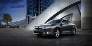 Sleek And Sporty Acura Tsx On The Road Wallpaper