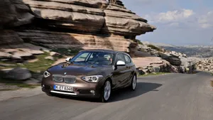 Sleek And Sporty Bmw 1 Series In Action Wallpaper