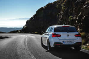 Sleek And Sporty Bmw 1 Series In Urban Environment Wallpaper