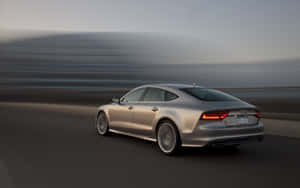 Sleek And Stunning Audi S7 On The Open Road Wallpaper