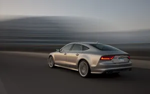 Sleek And Stunning Audi S7 On The Open Road Wallpaper