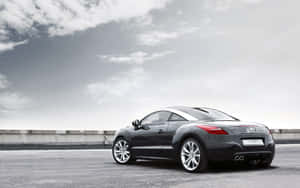 Sleek And Stunning Peugeot Rcz In Action Wallpaper