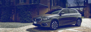 Sleek And Stylish 2021 Fiat Tipo On The Road Wallpaper