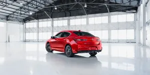 Sleek And Stylish Acura Ilx On The Move Wallpaper