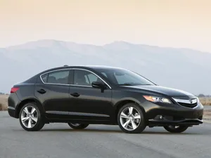 Sleek And Stylish Acura Ilx On The Road Wallpaper