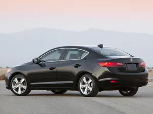 Sleek And Stylish Acura Ilx On The Road Wallpaper