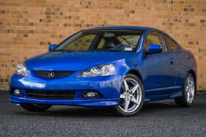 Sleek And Stylish Acura Rsx On The Road Wallpaper