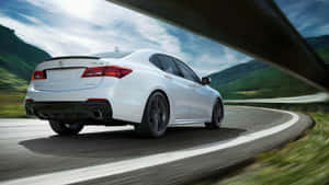 Sleek And Stylish Acura Tlx On The Road Wallpaper