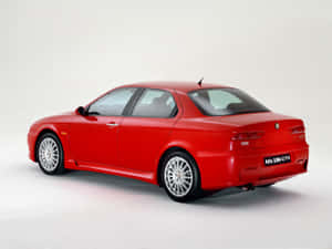 Sleek And Stylish Alfa Romeo 156 On The Road Wallpaper
