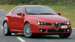 Sleek And Stylish Alfa Romeo Brera On The Road Wallpaper