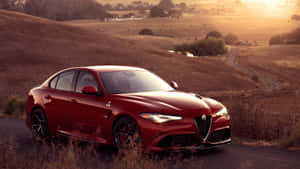 Sleek And Stylish Alfa Romeo Giulia On The Road Wallpaper