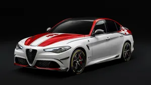 Sleek And Stylish Alfa Romeo Stelvio Suv In Scenic Mountain Setting Wallpaper