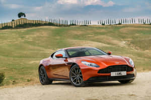 Sleek And Stylish Aston Martin Db11 In Action Wallpaper