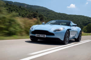 Sleek And Stylish Aston Martin Db11 On The Road Wallpaper