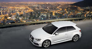 Sleek And Stylish Audi A3 Sports Car On The Road Wallpaper