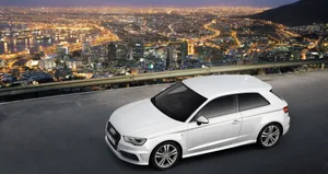 Sleek And Stylish Audi A3 Sports Car On The Road Wallpaper