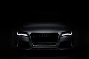 Sleek And Stylish Audi A4 On The Road Wallpaper