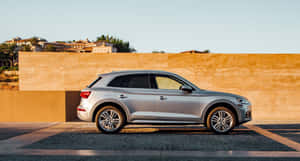 Sleek And Stylish Audi Q5 On The Road Wallpaper