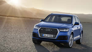 Sleek And Stylish Audi Q7 In Motion Wallpaper