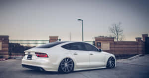 Sleek And Stylish Audi S7 In Motion Wallpaper