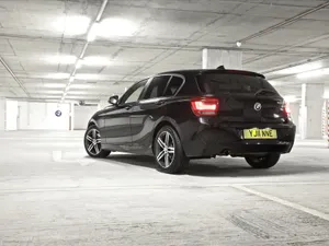 Sleek And Stylish Bmw 1 Series In Action Wallpaper