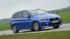 Sleek And Stylish Bmw 2 Series In Action Wallpaper