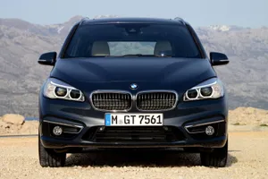 Sleek And Stylish Bmw 2 Series On The Road Wallpaper