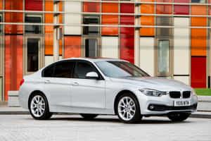 Sleek And Stylish Bmw 3 Series On Asphalt Wallpaper