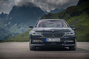 Sleek And Stylish Bmw 7 Series In Motion Wallpaper