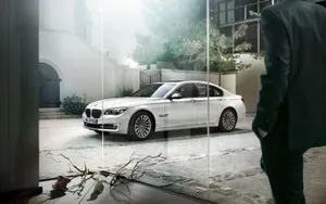 Sleek And Stylish Bmw 7 Series In Motion Wallpaper