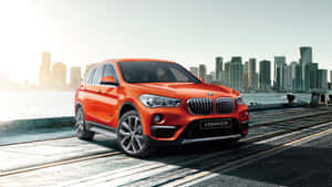 Sleek And Stylish Bmw X1 On The Road Wallpaper