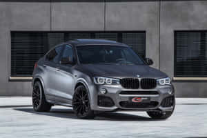 Sleek And Stylish Bmw X4 In Action Wallpaper