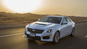 Sleek And Stylish Cadillac Cts Cruising The Streets Wallpaper