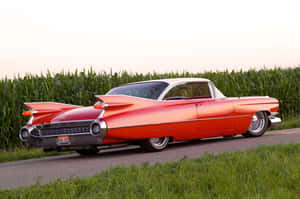 Sleek And Stylish Cadillac Eldorado Cruising On The Open Road Wallpaper