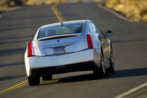 Sleek And Stylish Cadillac Elr On The Road Wallpaper