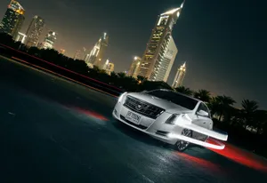 Sleek And Stylish Cadillac Xts In An Urban Environment Wallpaper