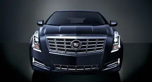 Sleek And Stylish Cadillac Xts In Motion Wallpaper