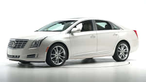 Sleek And Stylish Cadillac Xts On The Road Wallpaper